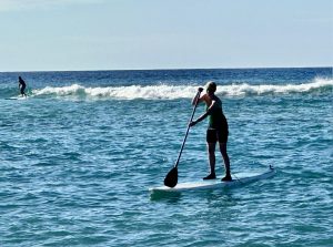 Paddleboarding is hard to do--especially on waves